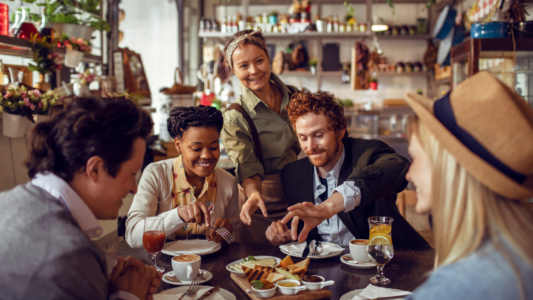 group eating out and the server is checking on them