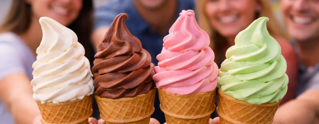 Four people showcase their soft serve ice cream cones