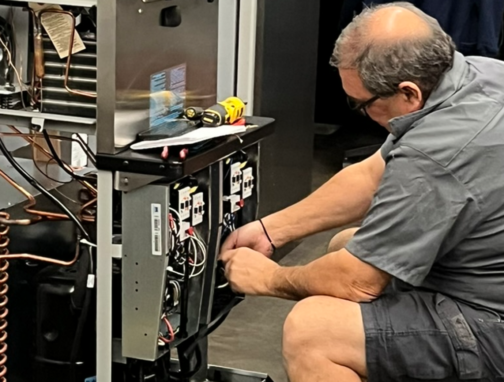 Service Technician does diagnostics on kitchen equipment